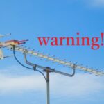 アンテナと「warning」の文字で工事の詐欺に注意のイメージ